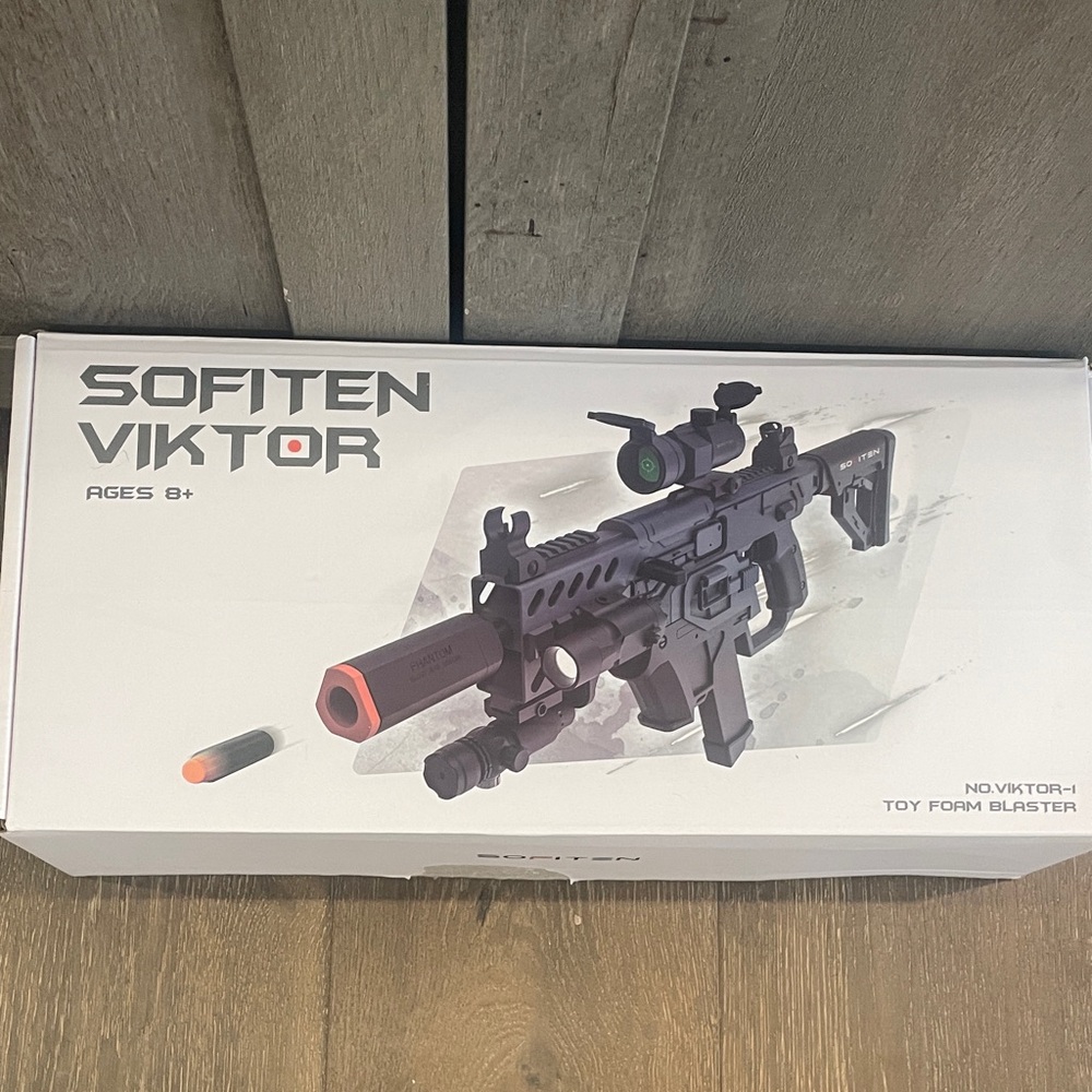 Black and Orange Toy Foam Blaster
